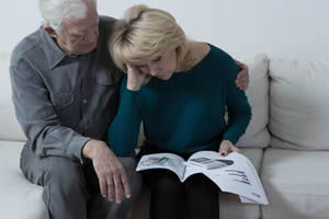 Husband and wife reviewing documents; Chico Trust Administration