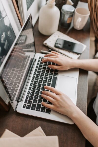 digital estate planning, image of female hands on a laptop