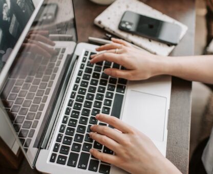 digital estate planning, image of female hands on a laptop