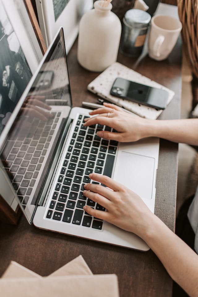 digital estate planning, image of female hands on a laptop