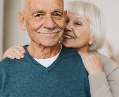 sandwich generation, long-term care, image of a senior man and woman smiling