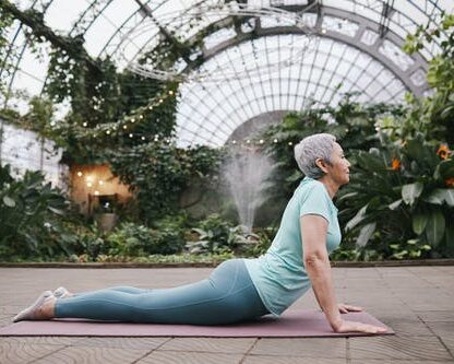 life insurance, image of senior woman doing upward dog yoga pose